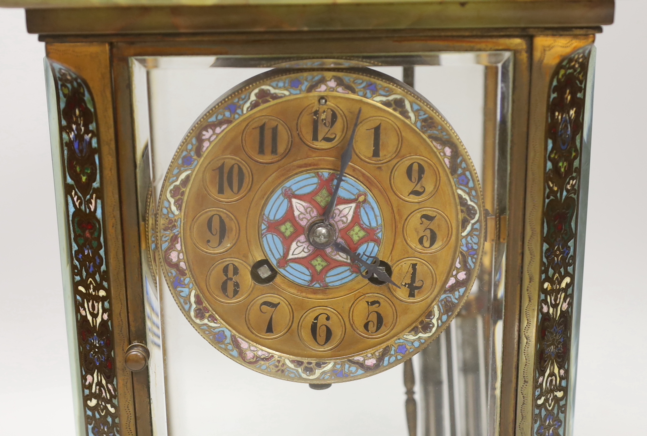 An early 20th century French green onyx and champleve enamel four glass mantel clock, 31cm